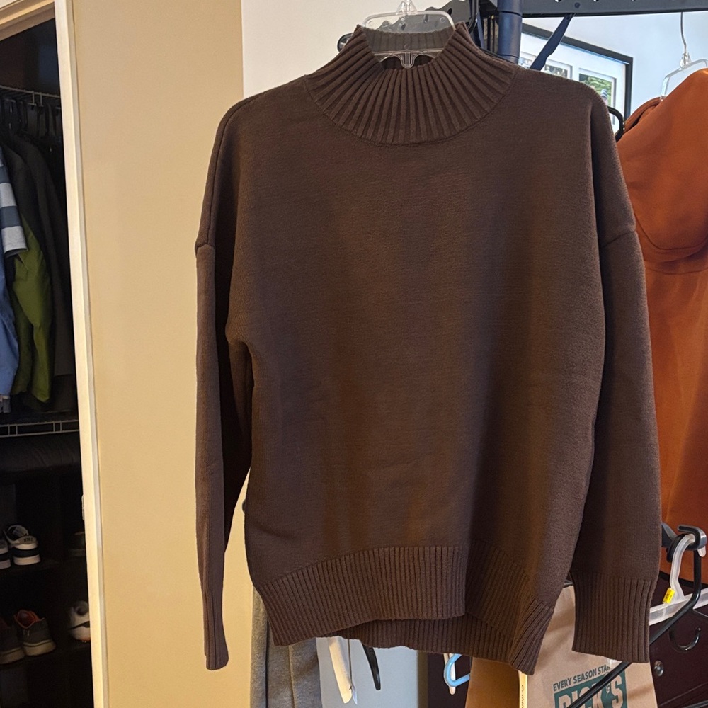 Oversized drop shoulder crew neck sweater. Never worn, new with tags.